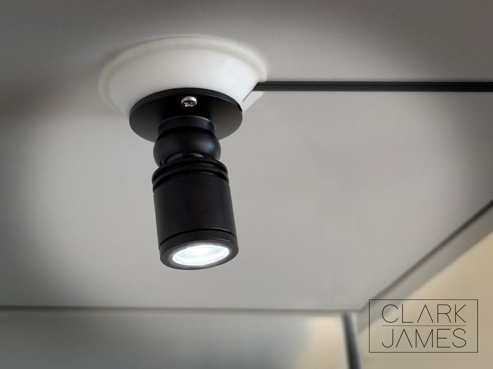 Display Case Mini Mount — Adhesive ceiling mount for cabinet spot lights.
